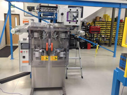The bagger is fed by the flipper to seal each compartment’s contents into perforated bags in AFIS.