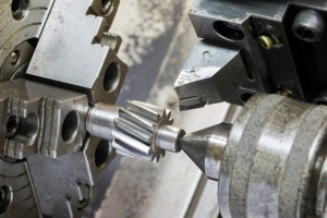 Operator machining automotive gear